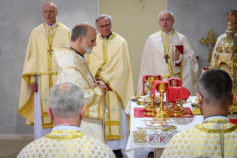 Right Reverend Borys Gudziak prays over the alter.