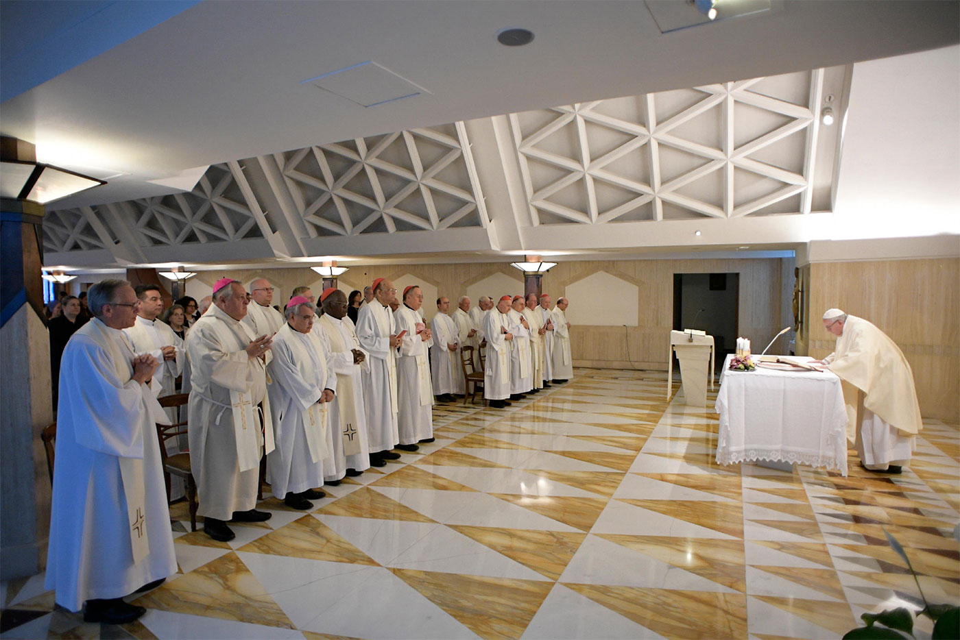 Fr. Jenkins (pictured left) concelebrates Mass with Pope Francis inside Casa Santa Marta.