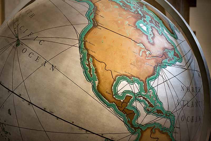 A globe showing the United States, Mexico, and a part of South America.