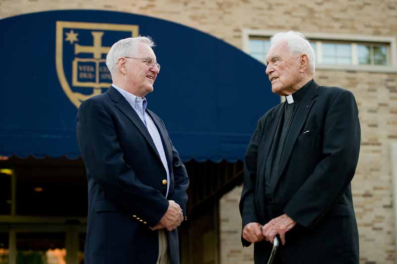 Tom Scanlon and Father Hesburgh stand next to each other.