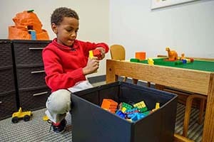 A child plays with legos.