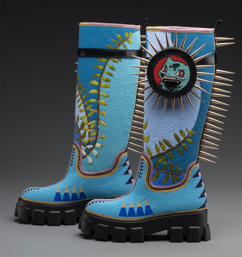 Tall boots covered in blue beading and intricate designs.