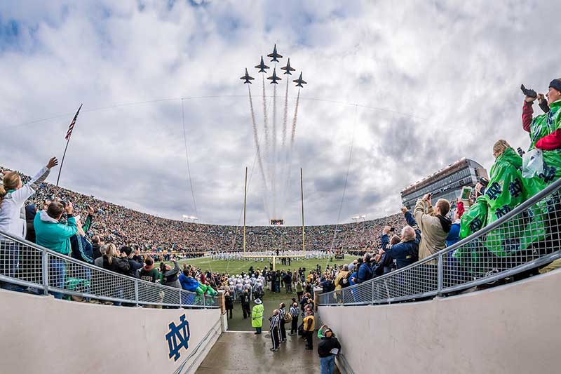 The Blue Angels fly over Notre Dame Stadium, packed full of fans, before the Navy game, 2013.