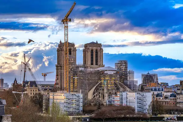 Wide angle morning view of the cathedral with scaffolding surrounding the structures.