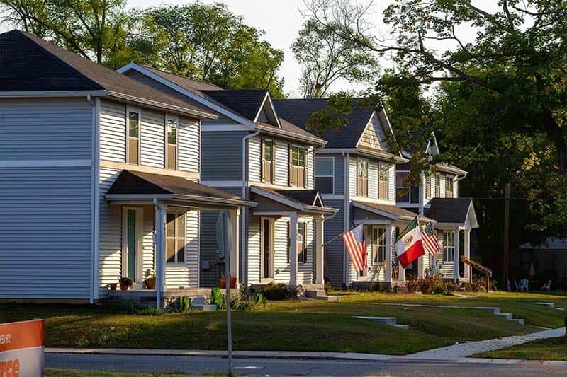 A street block of newly constructed homes.