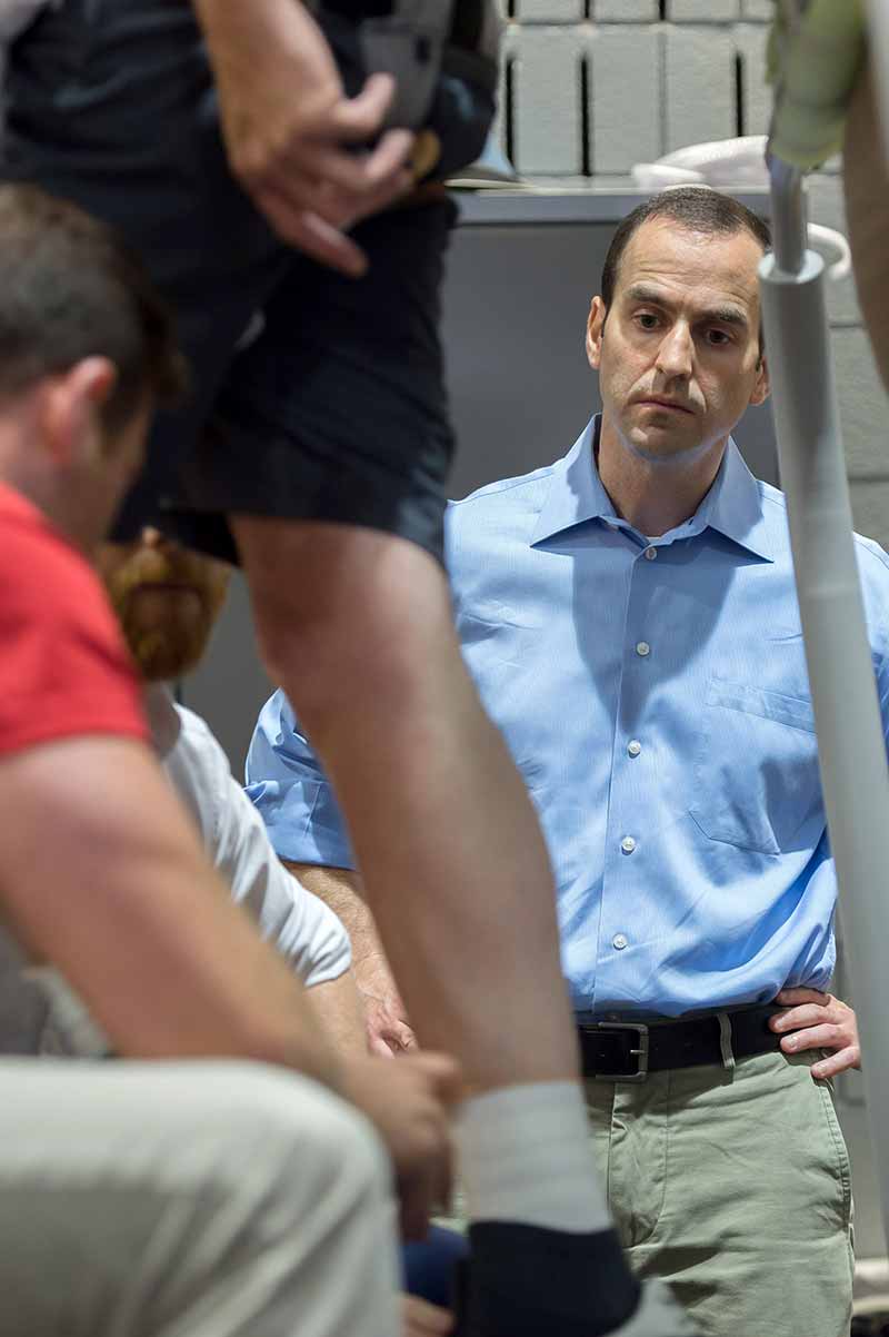 Engineering professor Jim Schmiedeler watches as Aaron Wolfe participates in a rehab study at The Ohio State University Medical Center in Columbus, Ohio.