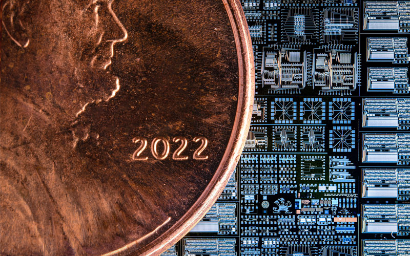 Image of a chip with a penny on top to show size.