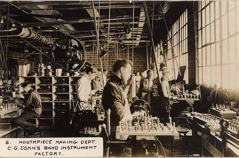 An archive photo of the ConnSelmer factory, labeled the Mouthpiece making department.