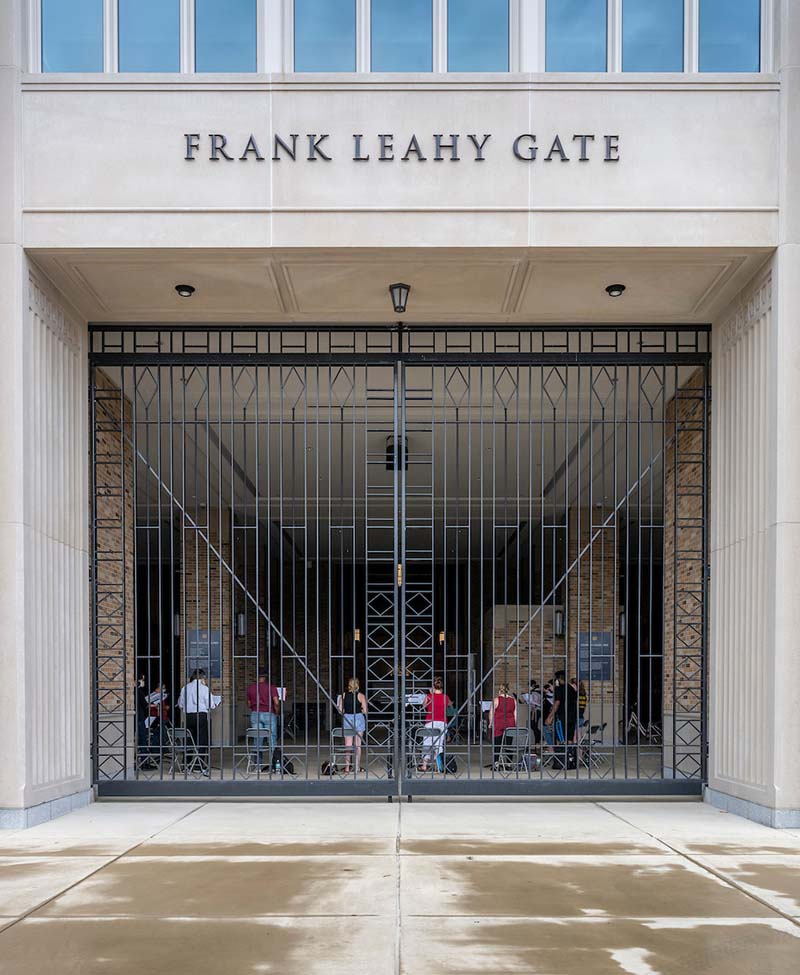 From the exterior looking into Frank Leahy Gate is the group of students singing.