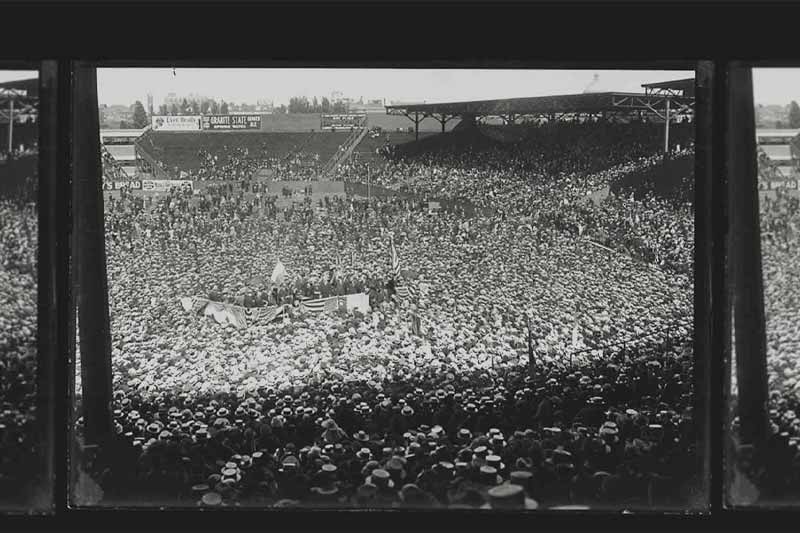 An archival photo of a stadium packed full of poeple.