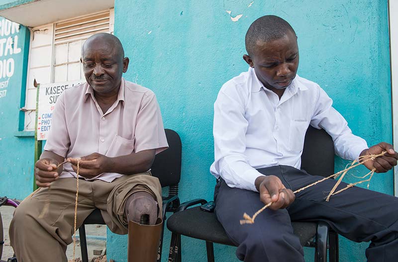 Landmine victims make rope out of banana fiber.