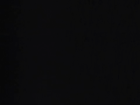 Particles appear on a black screen.